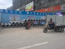 Pipes lined outside a construction site in Futian District.